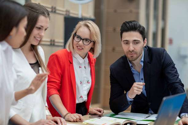 Business people working in office together