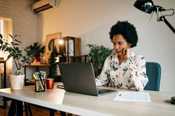 Busy hispanic business woman working from home office