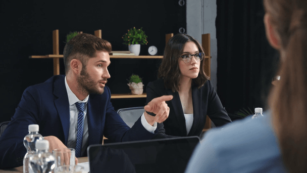 stock-video-young-businessman-talking-pointing-finger